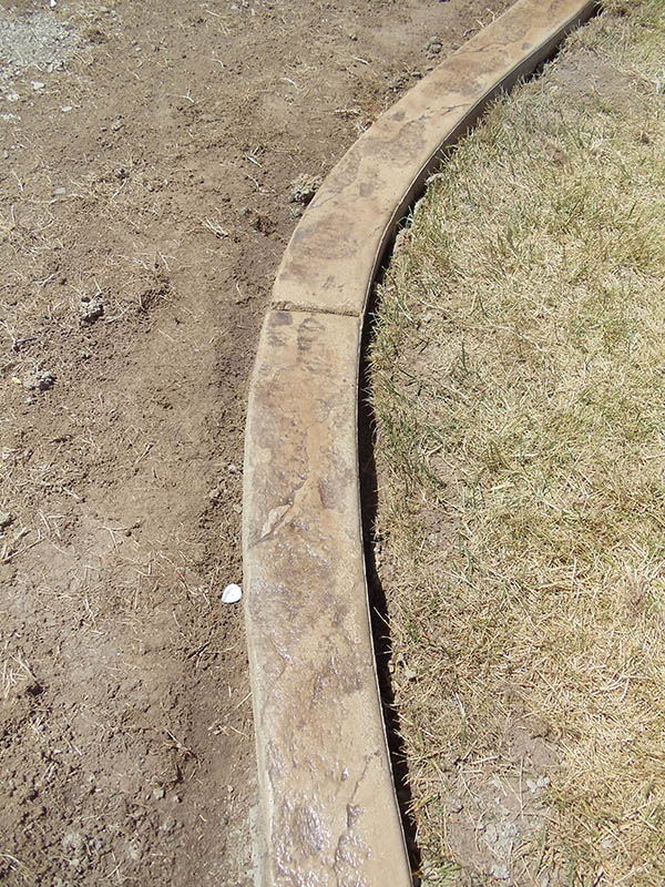 Custom Concrete mow strip landscape curbing in Roseville