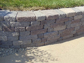 Custom brick masonry steps with bullnose edging matching a natural clay paver landing