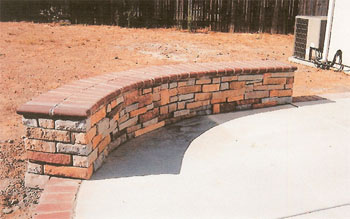 Custom brick masonry steps with bullnose edging matching a natural clay paver landing