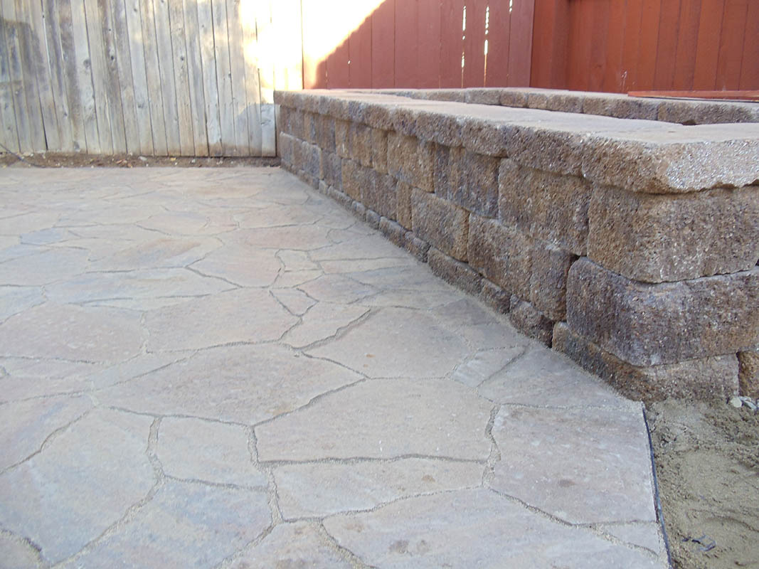 Custom brick masonry steps with bullnose edging matching a natural clay paver landing