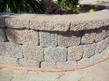 Custom brick masonry steps with bullnose edging matching a natural clay paver landing