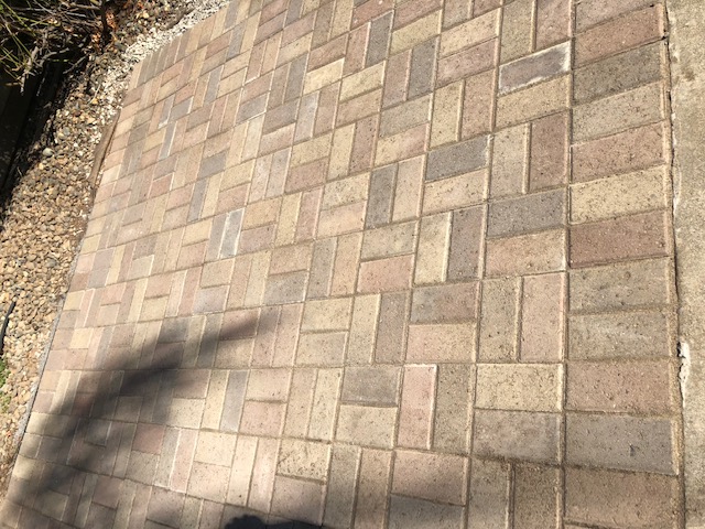 Custom brick masonry steps with bullnose edging matching a natural clay paver landing