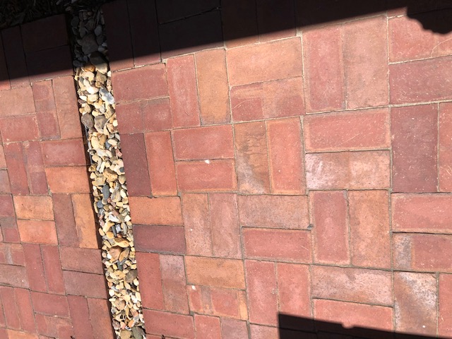 Custom brick masonry steps with bullnose edging matching a natural clay paver landing