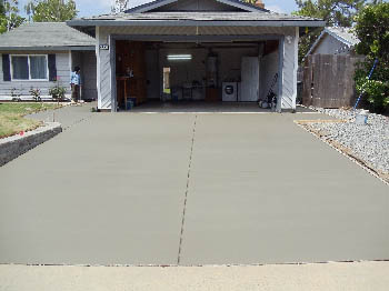 Reinforced concrete driveway installation with stamped border in Sacramento, CA.