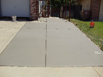 Reinforced concrete driveway installation with stamped border in Sacramento, CA.
