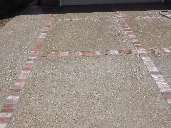 Reinforced concrete driveway installation with stamped border in Sacramento, CA.