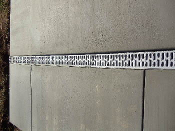 Reinforced concrete driveway installation with stamped border in Sacramento, CA.