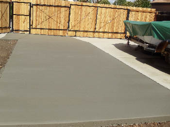 Reinforced concrete driveway installation with stamped border in Sacramento, CA.