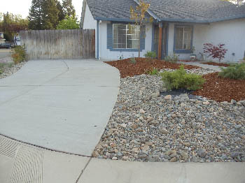 Reinforced concrete driveway installation with stamped border in Sacramento, CA.