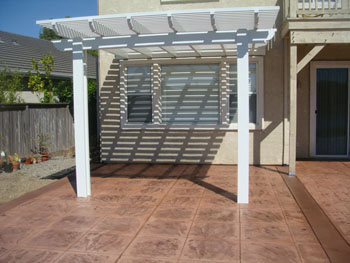 Custom stamped concrete patio with fire pit area installed by Delta Construction in Elk Grove, CA