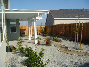 Custom stamped concrete patio with fire pit area installed by Delta Construction in Elk Grove, CA