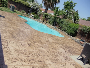 Custom Ashlar Slate stamped concrete pool deck with cool deck finish in Folsom, CA