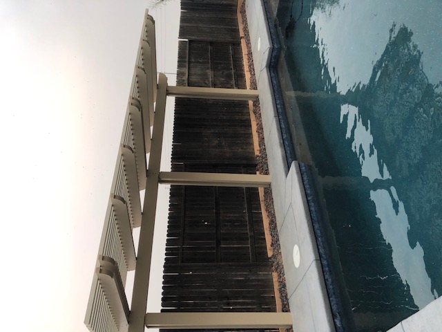 Custom Ashlar Slate stamped concrete pool deck with cool deck finish in Folsom, CA