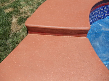 Custom Ashlar Slate stamped concrete pool deck with cool deck finish in Folsom, CA