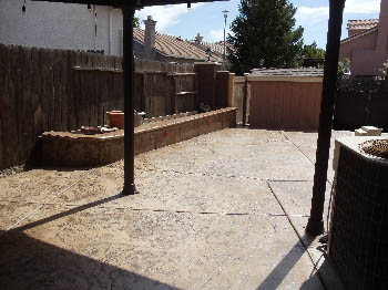 Engineered interlocking concrete block retaining wall for hillside erosion control