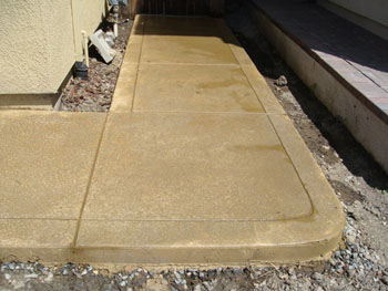 Close up of a slip resistant salt rock finish concrete pool deck in Elk Grove, CA