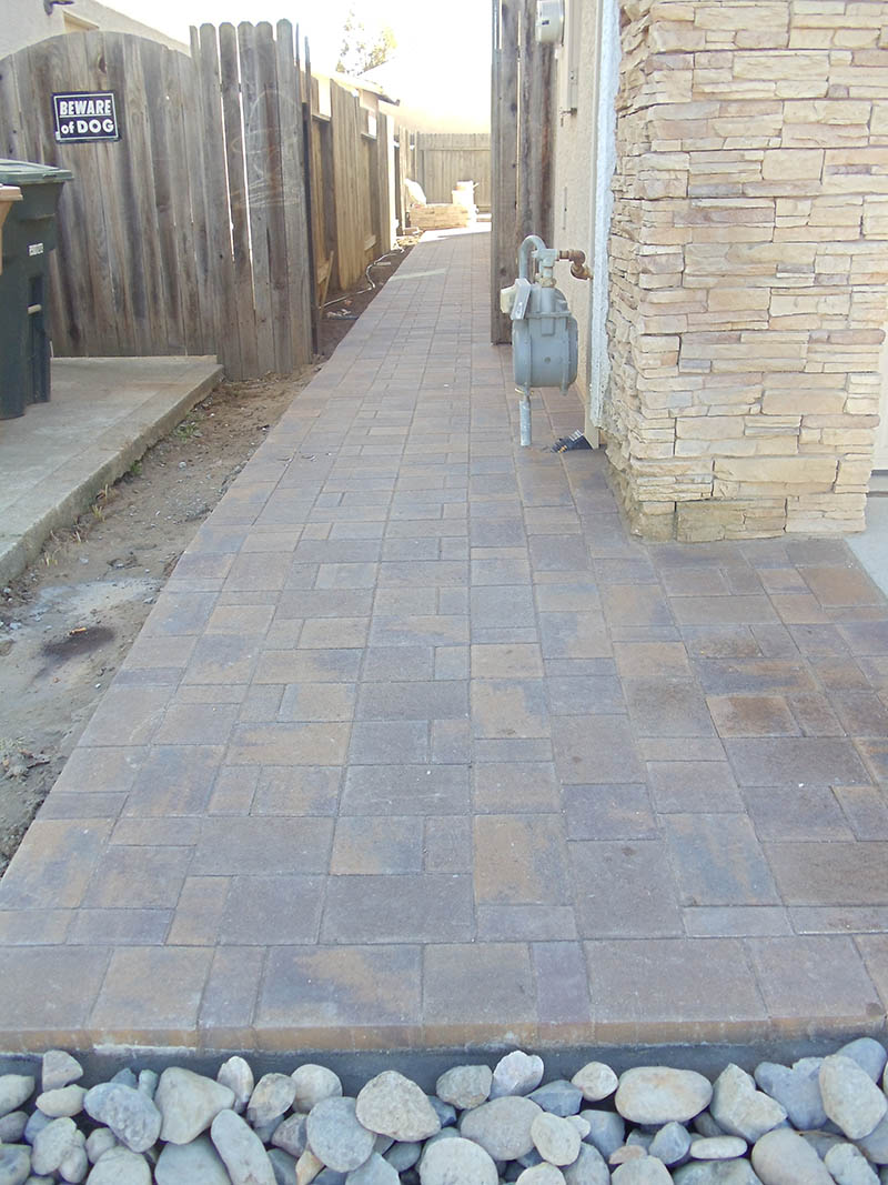 Curved stamped concrete walkway with charcoal border in Elk Grove, CA