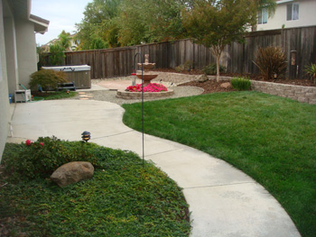 Curved stamped concrete walkway with charcoal border in Elk Grove, CA