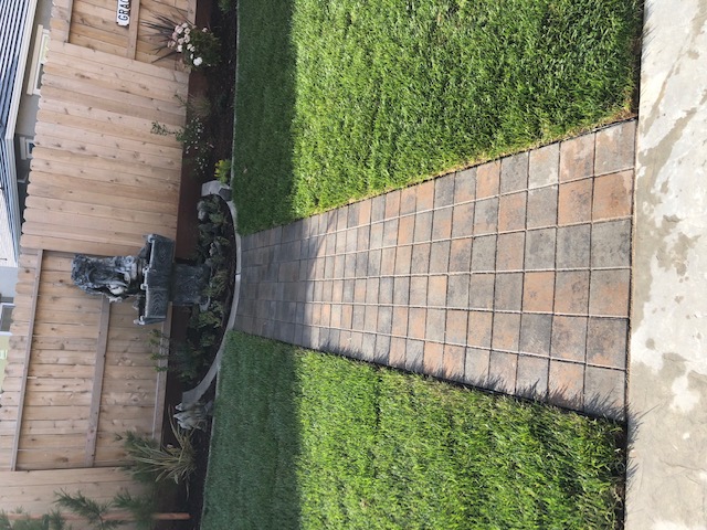 Curved stamped concrete walkway with charcoal border in Elk Grove, CA