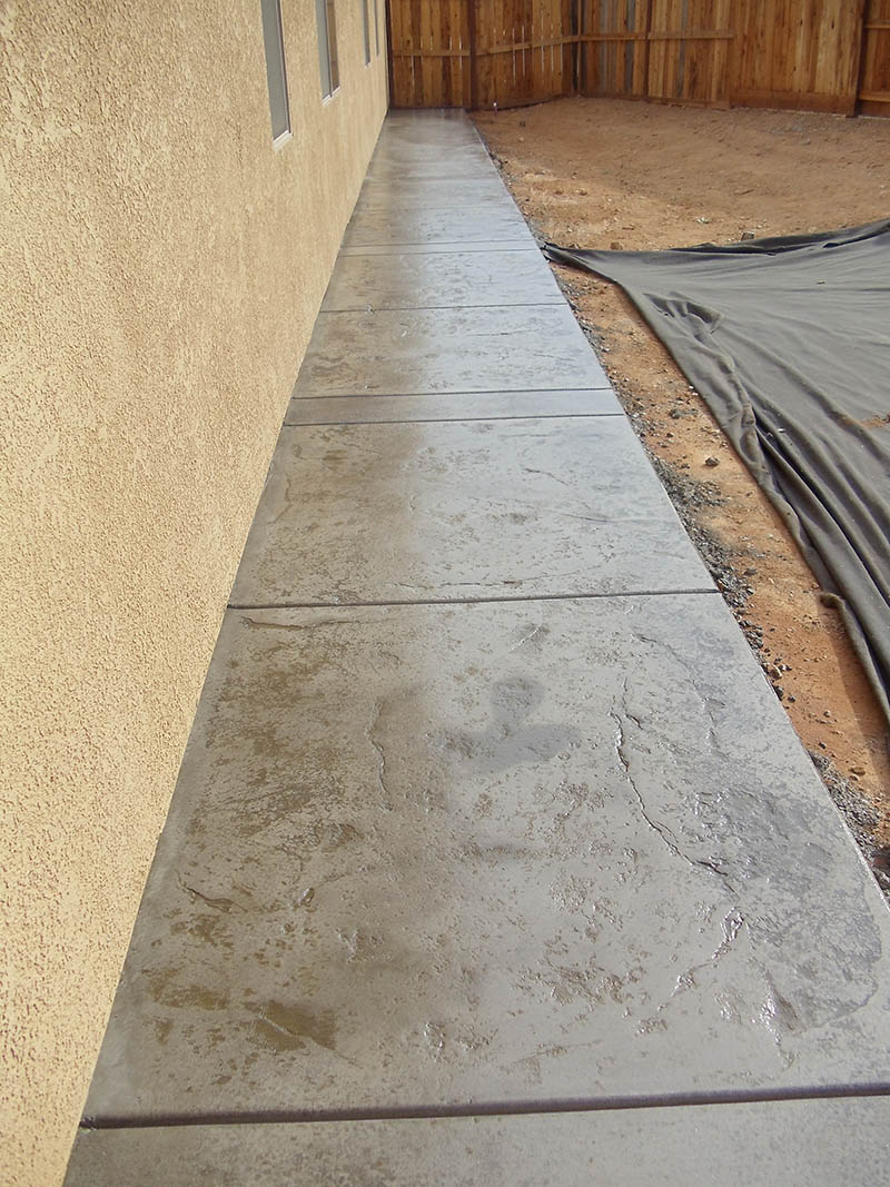 Curved stamped concrete walkway with charcoal border in Elk Grove, CA