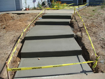 Custom poured concrete steps with Ashlar Slate stamped finish in Elk Grove, CA