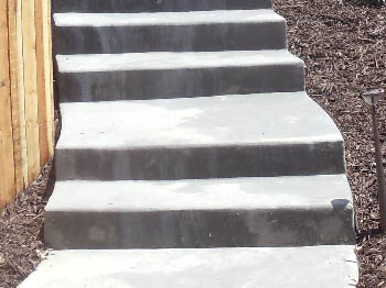 Custom poured concrete steps with Ashlar Slate stamped finish in Elk Grove, CA